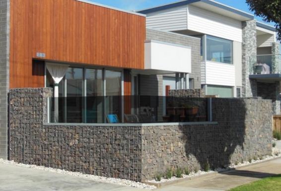 glass and gabion fence